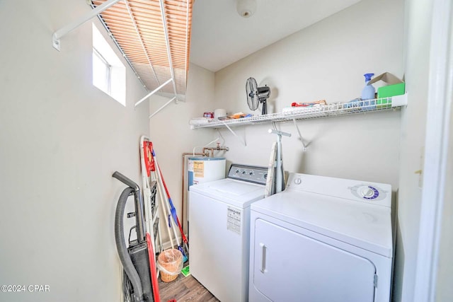 laundry room featuring washer and dryer and hardwood / wood-style floors