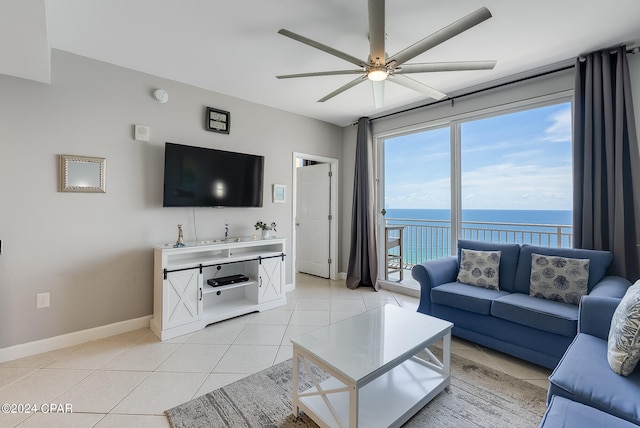 tiled living room with ceiling fan