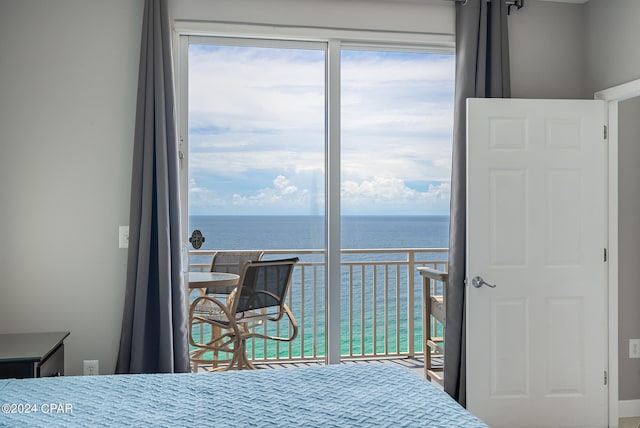 bedroom featuring a water view