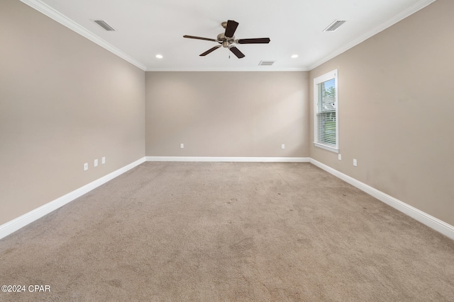 carpeted empty room with crown molding and ceiling fan