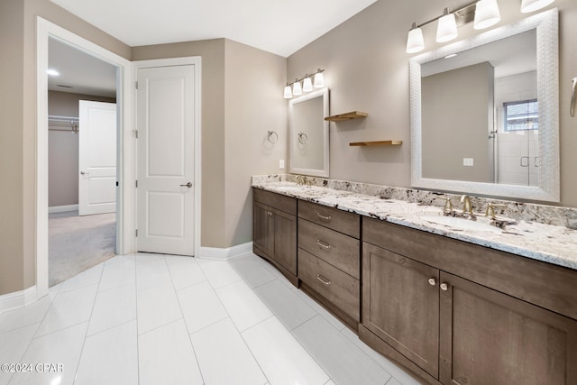 bathroom with tile patterned flooring, an enclosed shower, and vanity