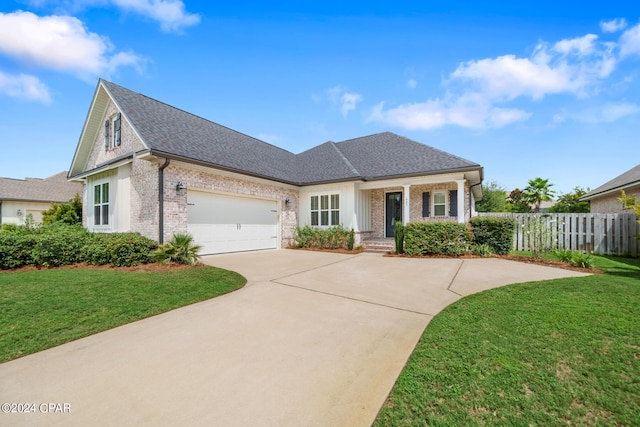 view of front of house with a front lawn and a garage