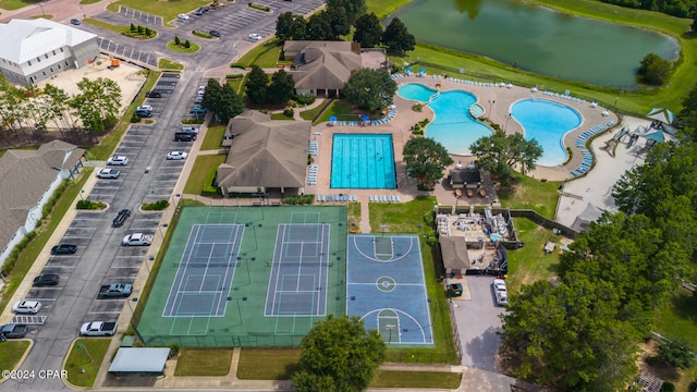 birds eye view of property with a water view