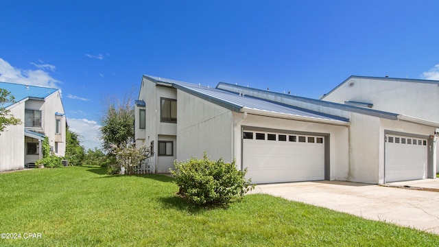 exterior space featuring a yard and a garage