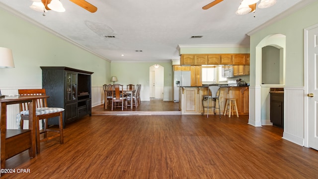 kitchen with dark wood-type flooring and ceiling fan