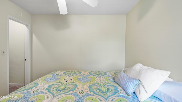 bedroom with ceiling fan and carpet floors