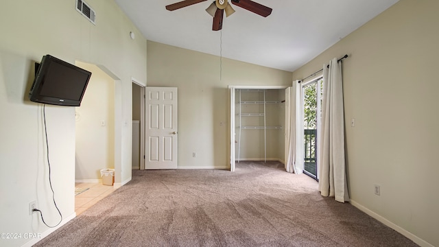 unfurnished bedroom featuring a closet, light carpet, access to exterior, lofted ceiling, and ceiling fan