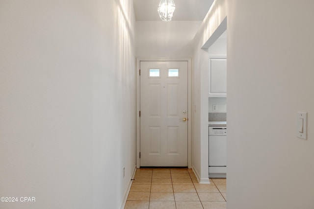 doorway with light tile patterned floors