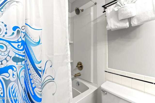 bathroom featuring tile walls, toilet, and shower / bath combo