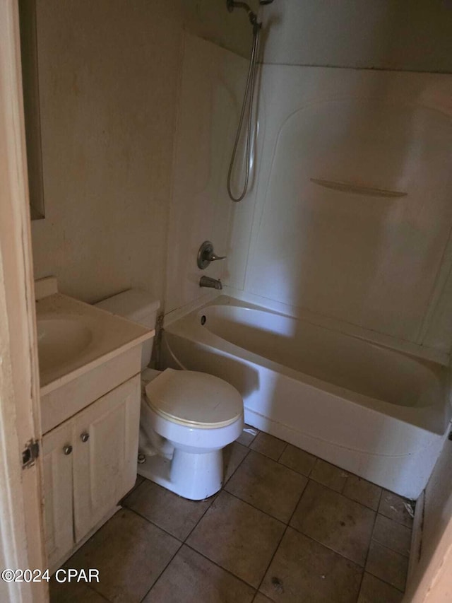 full bathroom featuring vanity, shower / washtub combination, tile patterned floors, and toilet