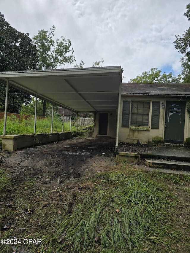 exterior space featuring a carport