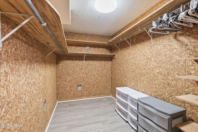 walk in closet featuring hardwood / wood-style floors