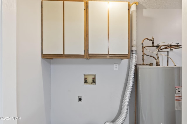 laundry area with cabinets, water heater, electric dryer hookup, a textured ceiling, and washer hookup