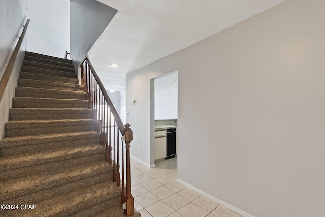 stairs featuring tile patterned floors