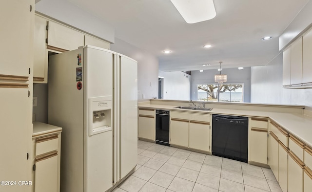 kitchen with white refrigerator with ice dispenser, sink, black dishwasher, and cream cabinetry