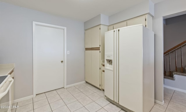 kitchen featuring white appliances and light tile patterned floors