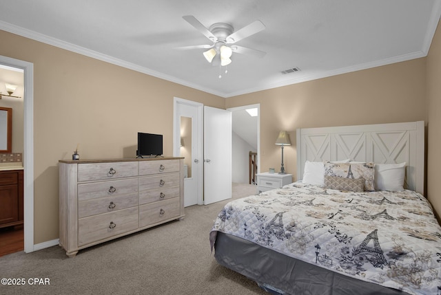 bedroom featuring light carpet, ornamental molding, ceiling fan, and ensuite bathroom