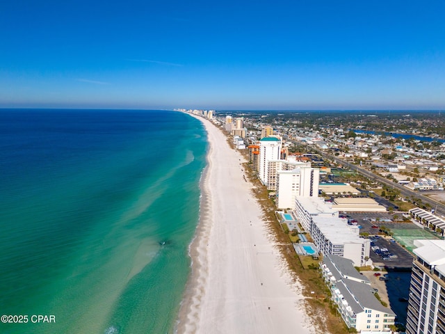 drone / aerial view with a beach view and a water view