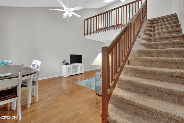 interior space with hardwood / wood-style floors and ceiling fan