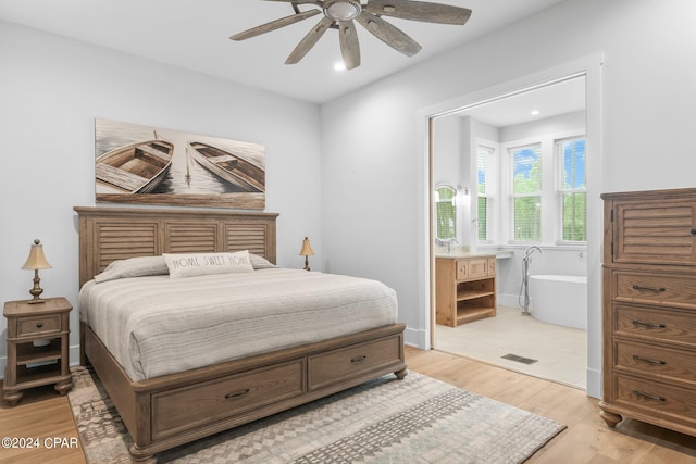 bedroom featuring light wood-type flooring and ceiling fan