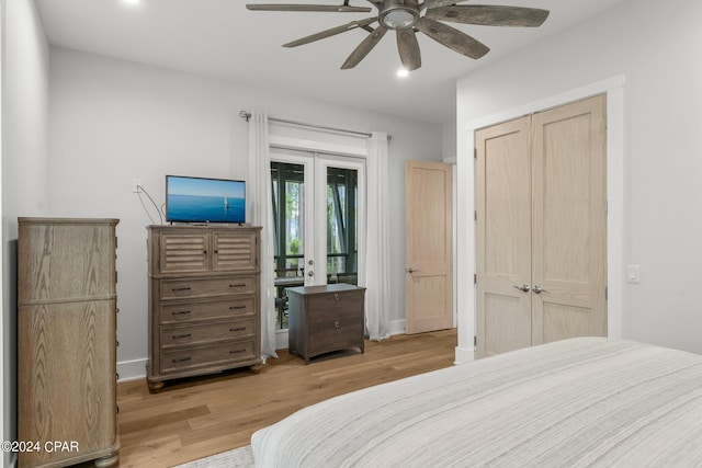 bedroom with french doors, light wood-type flooring, access to outside, ceiling fan, and a closet