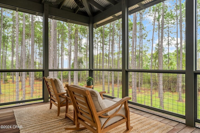 sunroom / solarium featuring outdoor dining area