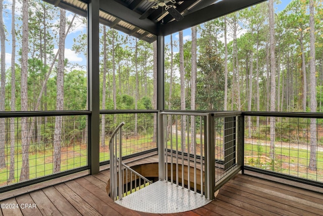 sunroom featuring ceiling fan