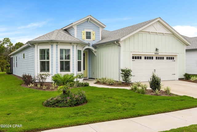 view of front facade featuring a garage and a front lawn