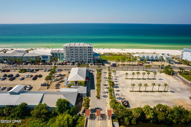 bird's eye view featuring a view of the beach and a water view