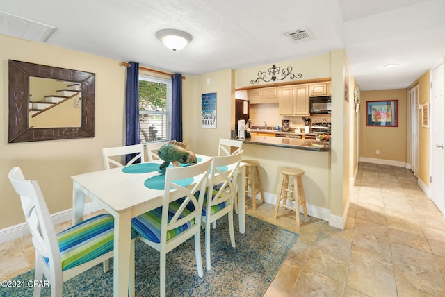 dining area featuring sink