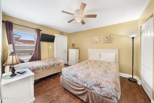 bedroom with a closet, ceiling fan, and dark hardwood / wood-style flooring