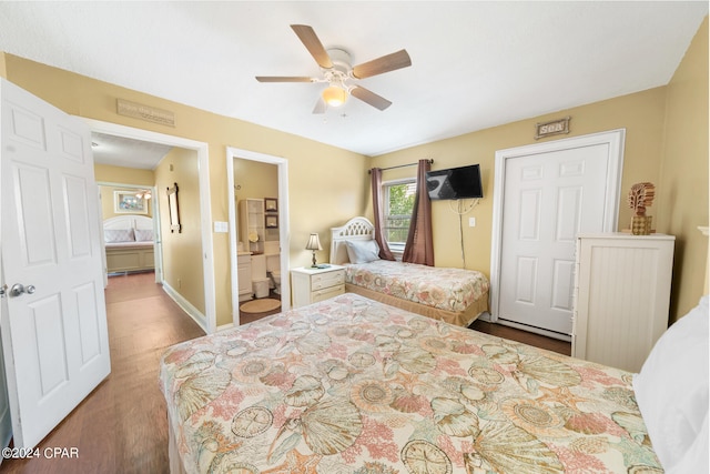 bedroom featuring ceiling fan, hardwood / wood-style flooring, and ensuite bathroom