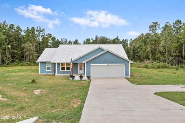 view of front of property with a garage and a front yard