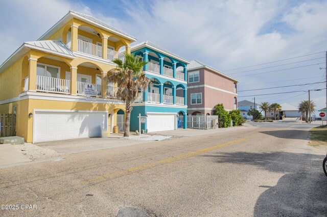 112 Riviera Dr, Panama City Beach, FL 32413 - view of building exterior with an attached garage and concrete driveway