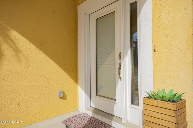 112 Riviera Dr, Panama City Beach, FL 32413 - doorway to property featuring stucco siding