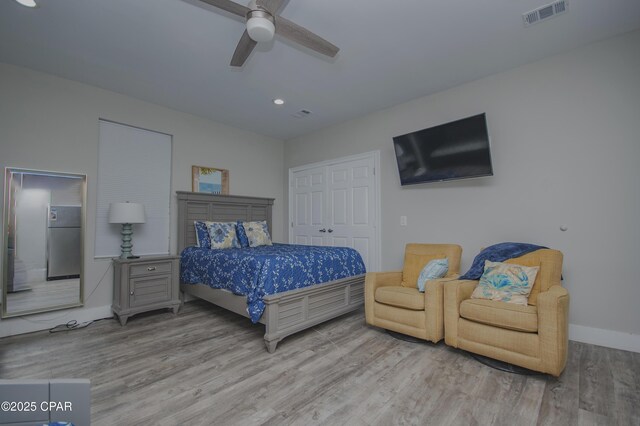 112 Riviera Dr, Panama City Beach, FL 32413 - bedroom with wood finished floors, baseboards, a closet, recessed lighting, and a ceiling fan