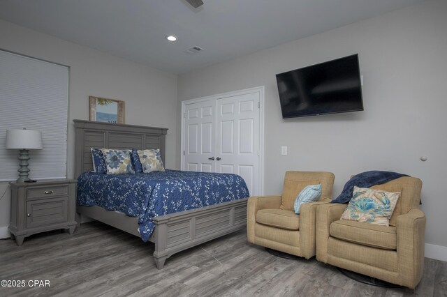 112 Riviera Dr, Panama City Beach, FL 32413 - bedroom featuring wood finished floors, a closet, and recessed lighting