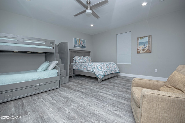 bedroom with ceiling fan and light hardwood / wood-style flooring