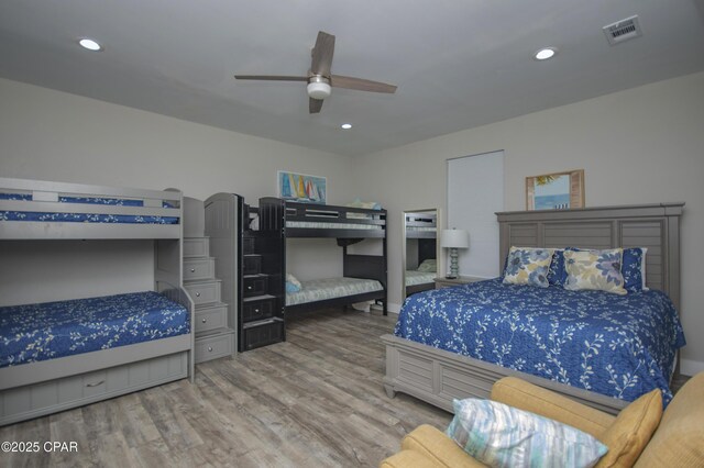 112 Riviera Dr, Panama City Beach, FL 32413 - bedroom with wood finished floors, recessed lighting, and ceiling fan