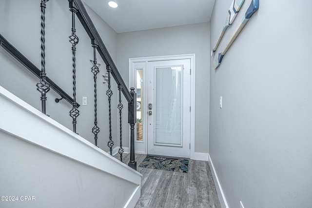 entryway with hardwood / wood-style flooring