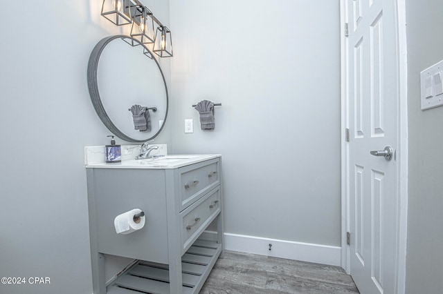 bathroom with vanity and wood-type flooring