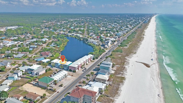 aerial view featuring a view of the beach and a water view