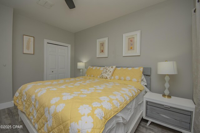 112 Riviera Dr, Panama City Beach, FL 32413 - bedroom with wood finished floors, a closet, baseboards, and ceiling fan