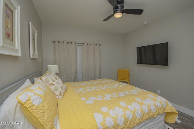 112 Riviera Dr, Panama City Beach, FL 32413 - bedroom featuring wood finished floors, baseboards, and a ceiling fan