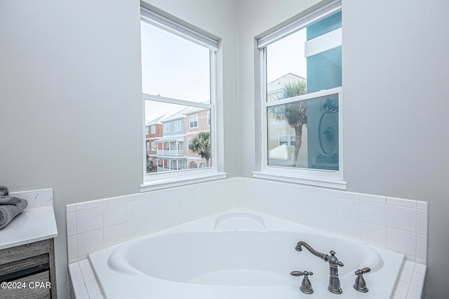 bathroom featuring tiled bath