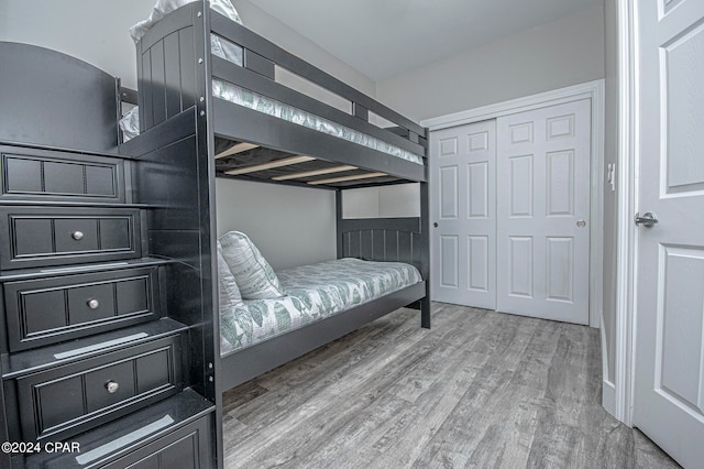 bedroom featuring a closet and light hardwood / wood-style floors