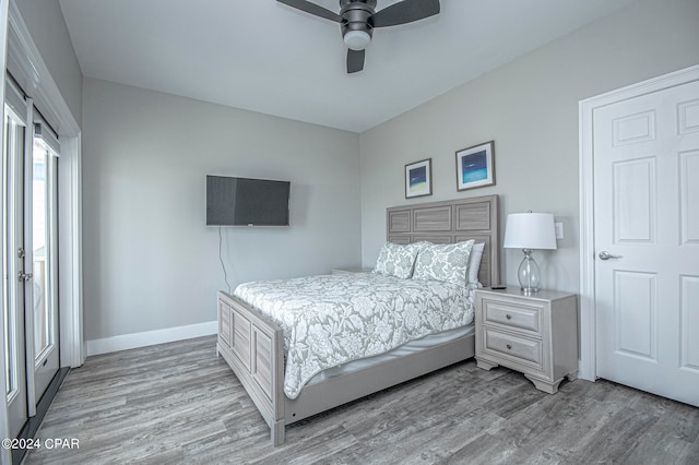 bedroom with ceiling fan and wood-type flooring