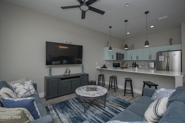 112 Riviera Dr, Panama City Beach, FL 32413 - living room featuring light wood-type flooring, a ceiling fan, recessed lighting, and baseboards