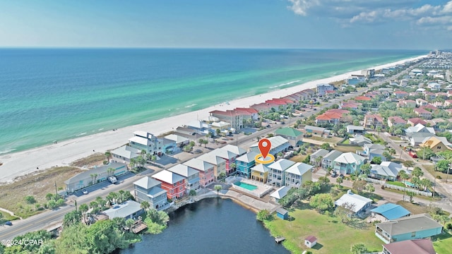 birds eye view of property featuring a view of the beach and a water view