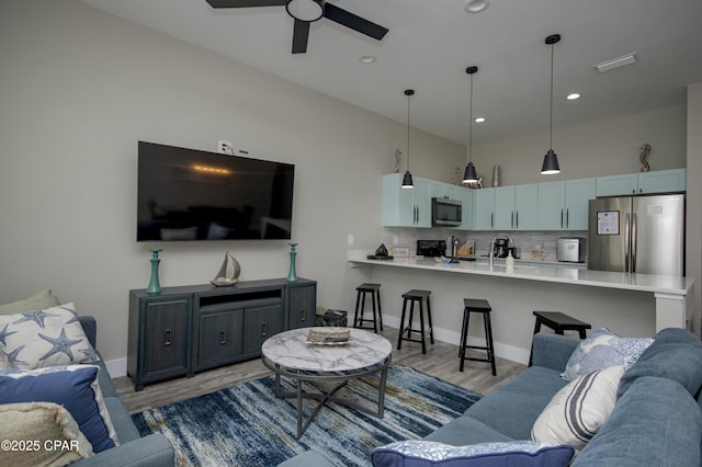 112 Riviera Dr, Panama City Beach, FL 32413 - living area with light wood-style flooring, ceiling fan, baseboards, and recessed lighting